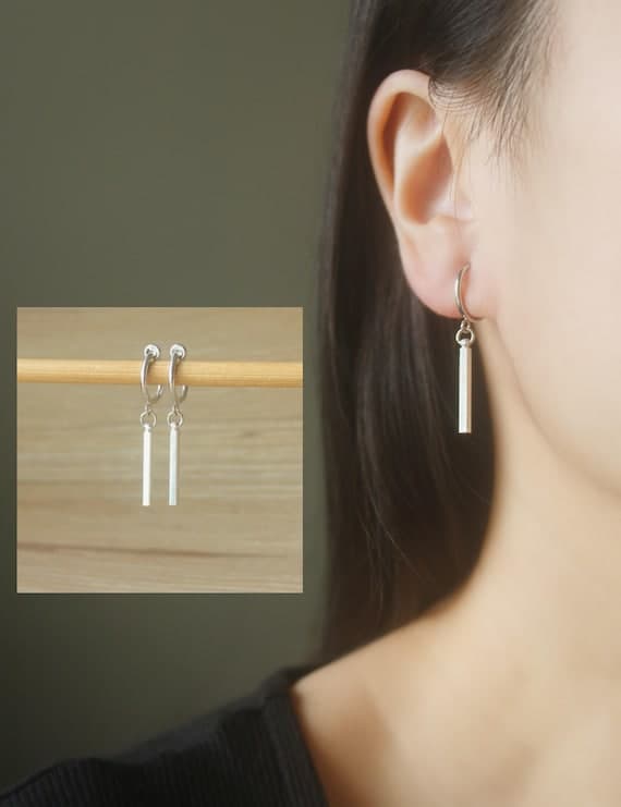 Silver rhodium-plated clip-on hoop earrings with dangle bar